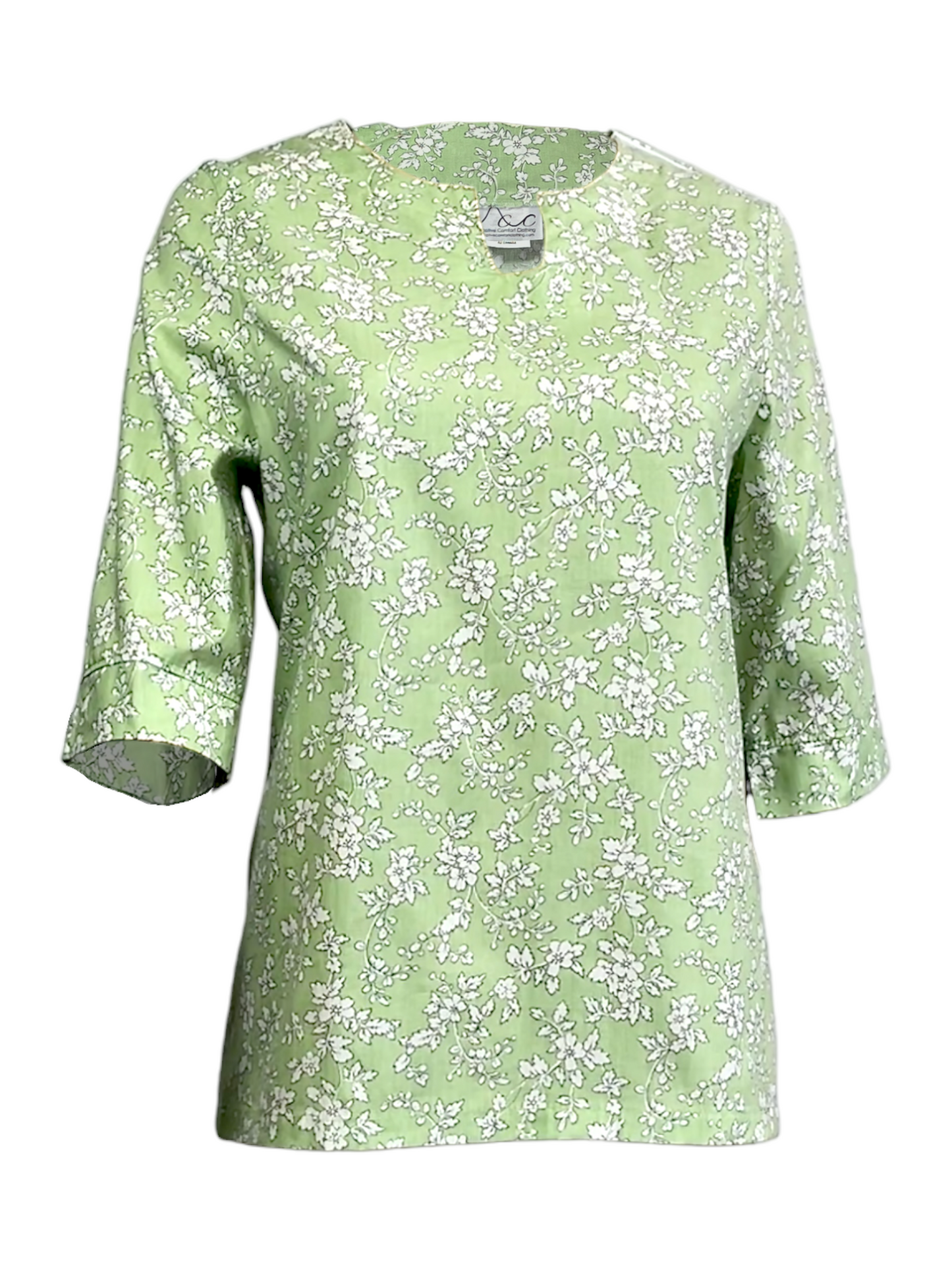 A floral print tunic blouse in mint green with 3/4 sleeves and a round neckline.