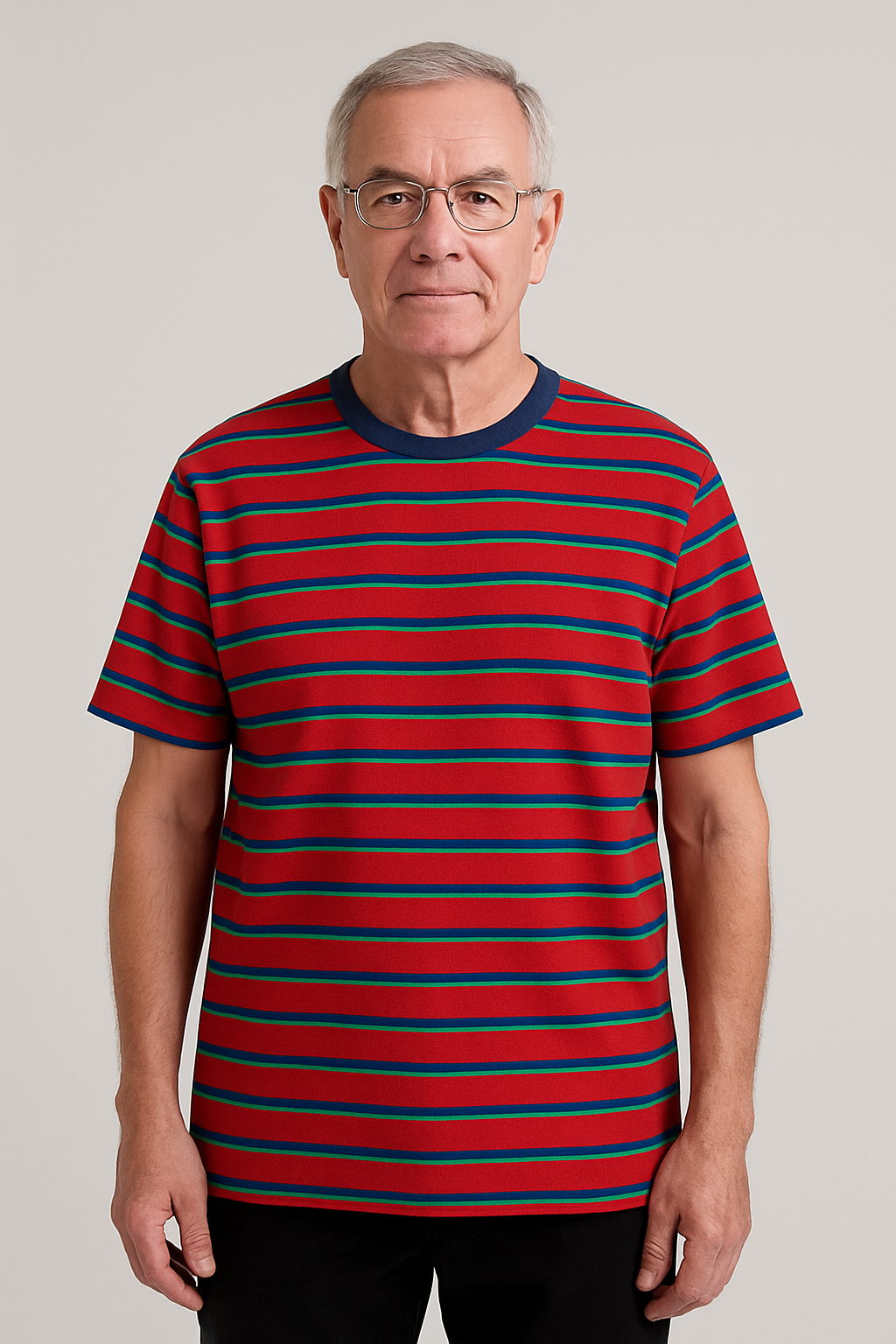 Man wearing a red and blue striped shirt against a plain background