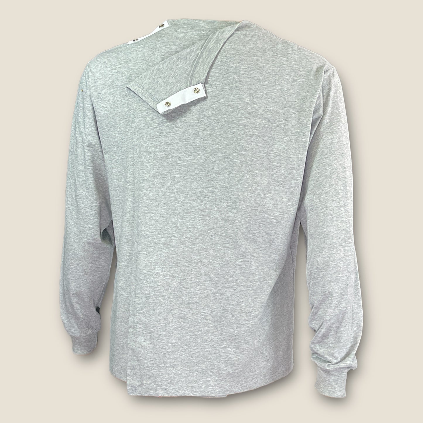 Close-up of shoulder snaps for simple, secure fastening.