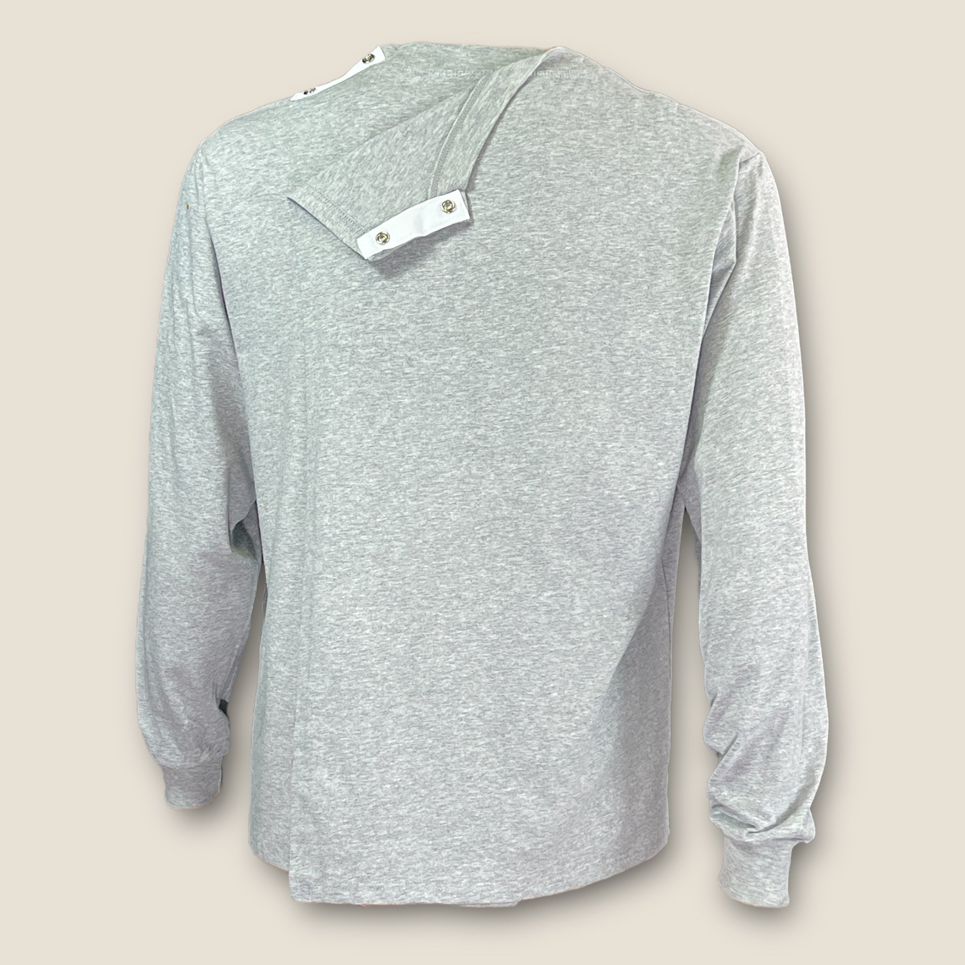 Close-up of shoulder snaps for simple, secure fastening.