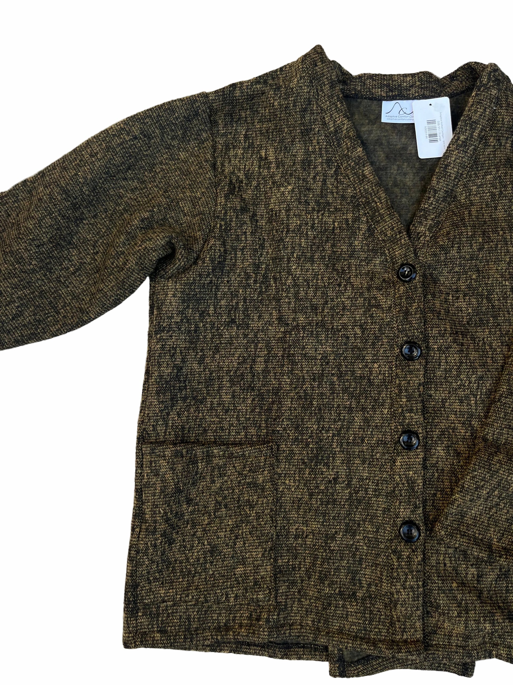 Folded brown jacket with buttons on a textured surface